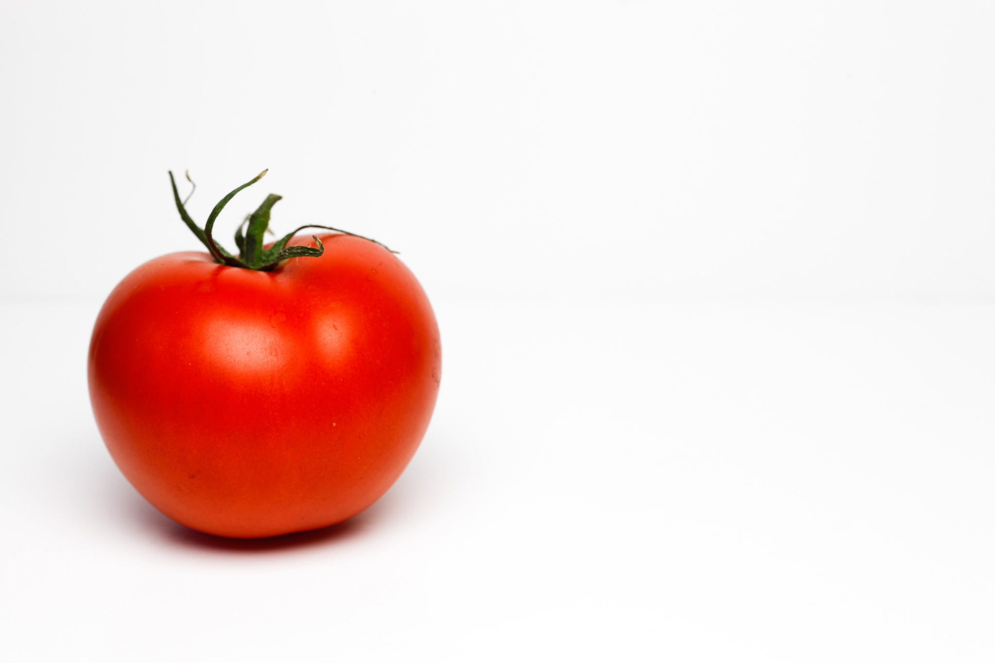 Image of a large tomato on a white background